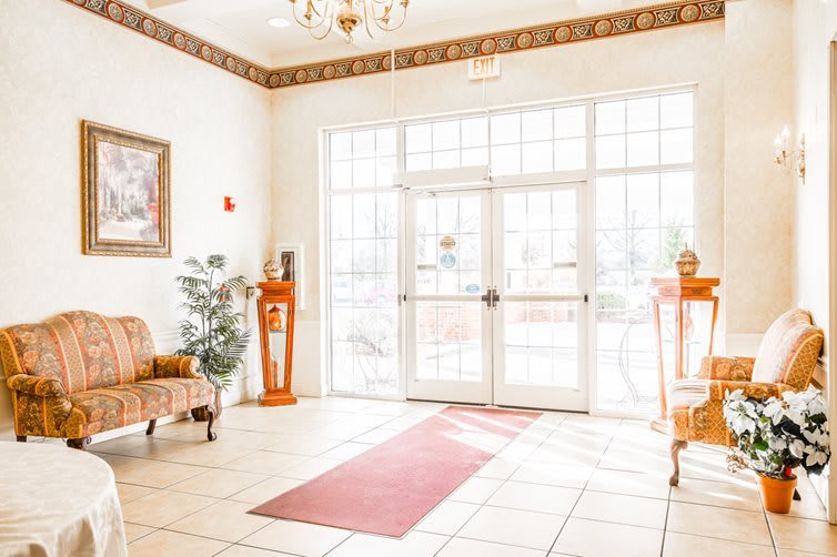 A bright and welcoming lobby area with furniture and decorations.