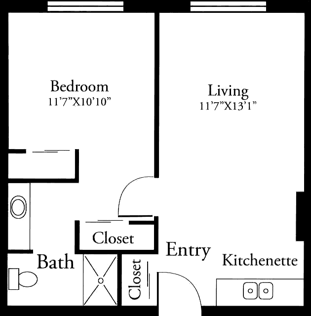 A floor plan of an apartment featuring a bedroom, living room, bathroom, and kitchenette.