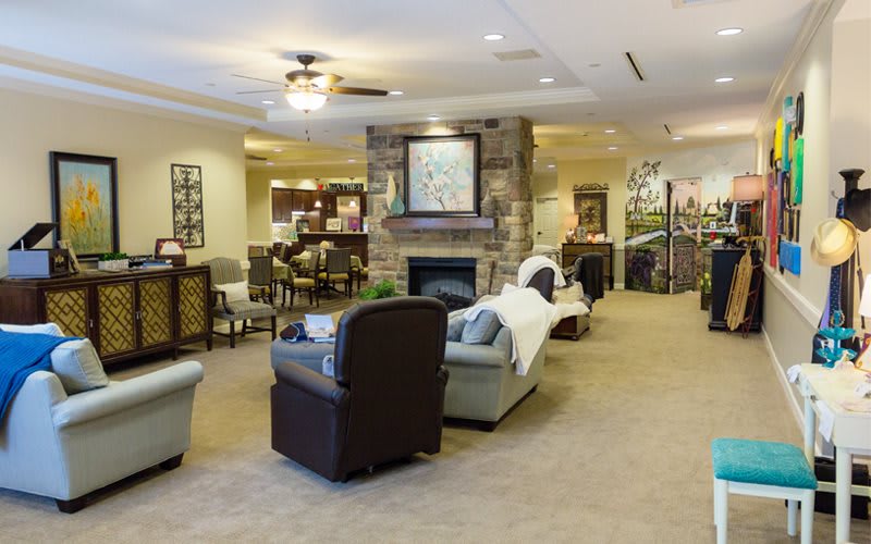 A cozy living room with a fireplace and comfortable seating.
