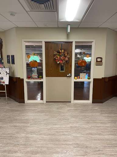 A welcoming entrance adorned with autumn decorations.