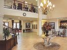 A luxurious lobby interior featuring a grand chandelier and elegant decor.