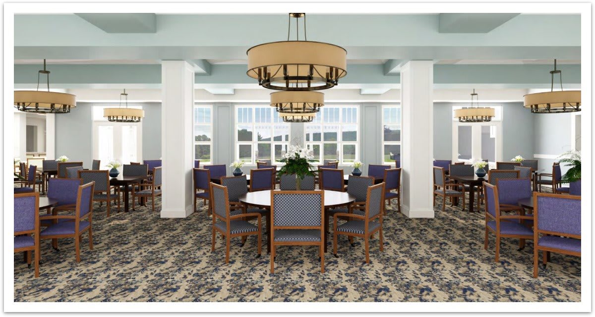 A well-lit dining area with multiple tables and chandeliers.