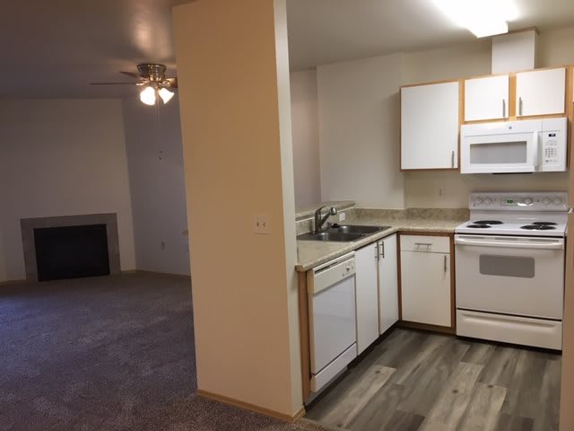 Open floor plan apartment with a kitchen and living room area.