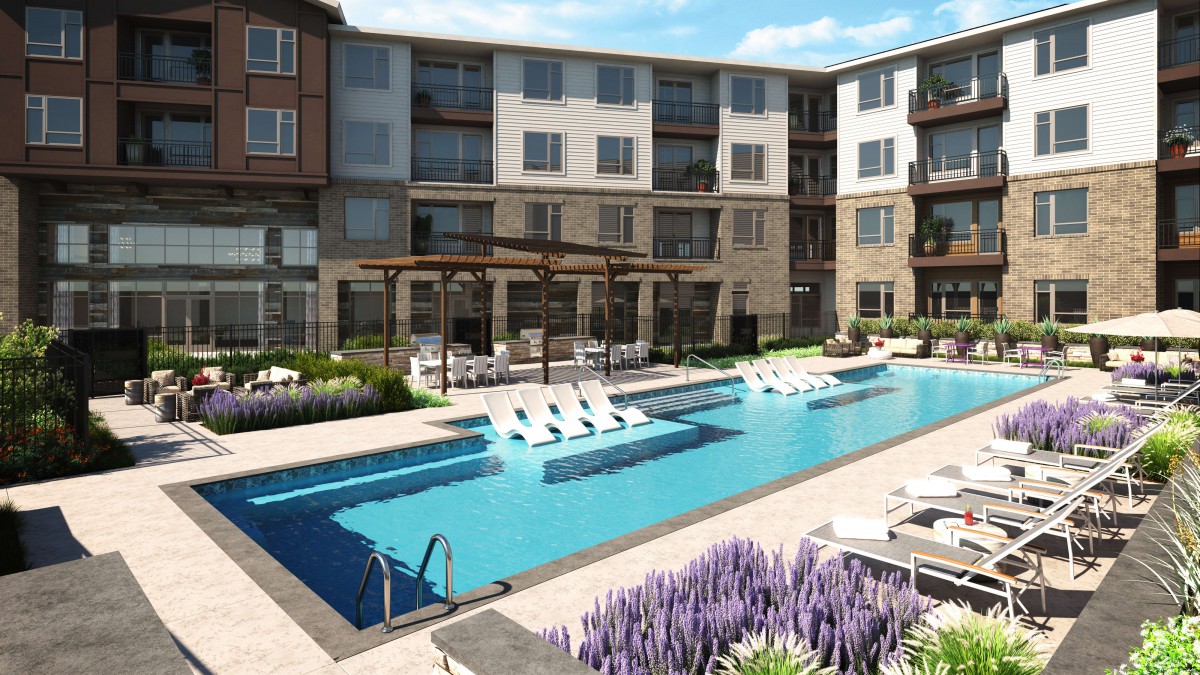 A modern apartment complex featuring a swimming pool and lounge area.