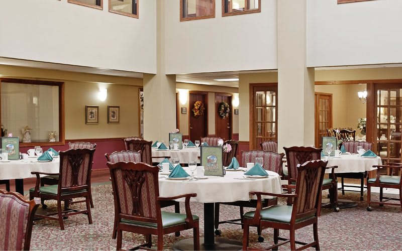 Elegant dining area with neatly arranged tables and classic decor.