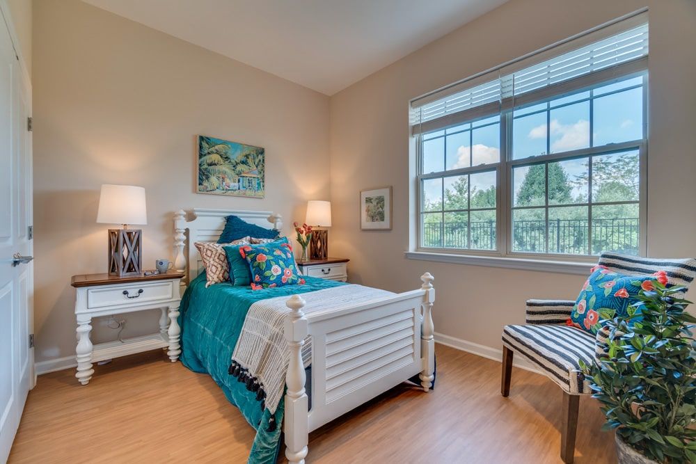 A cozy bedroom with a single bed and colorful decor.