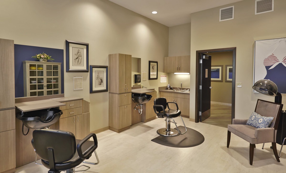 A modern hair salon interior with styling chairs and professional setup.