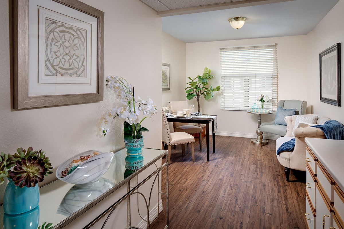 A cozy and modern living room with elegant furniture and abundant natural light.