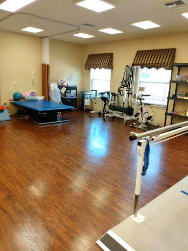 A well-equipped physical therapy room designed for rehabilitation exercises.