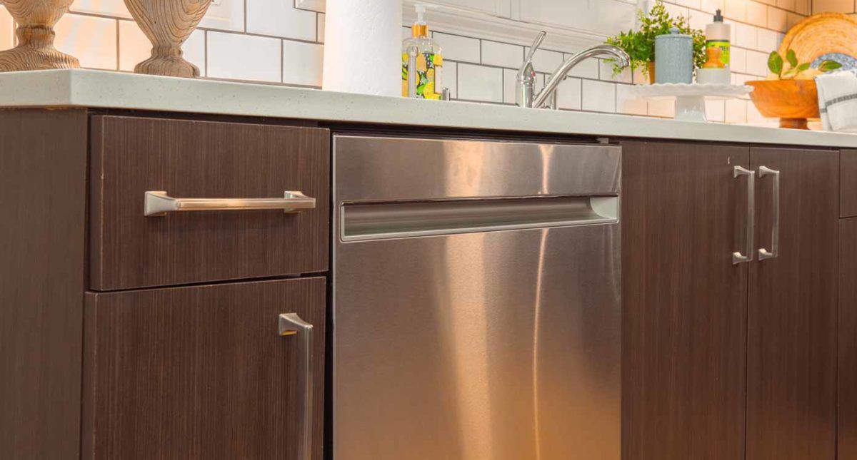 A modern kitchen with a stainless steel dishwasher.