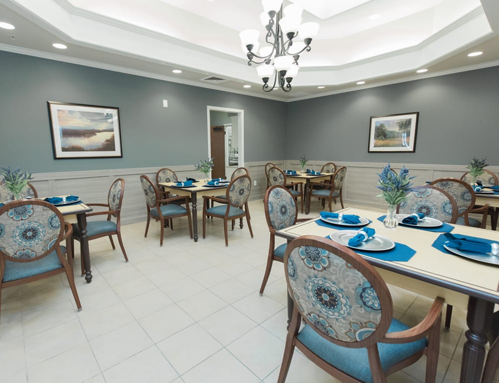 A well-appointed dining room with elegant decor and neatly arranged tables and chairs.
