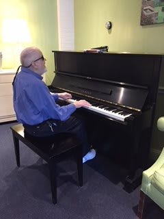 A person playing the piano indoors.