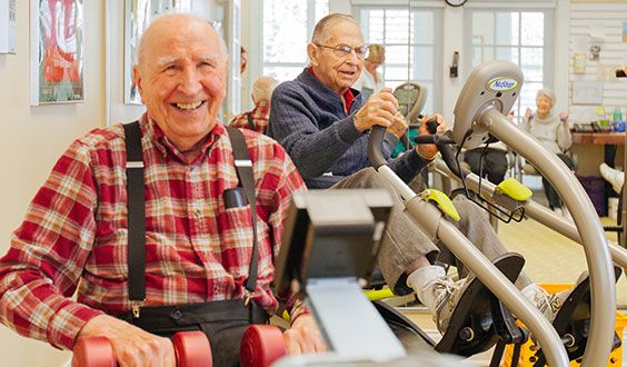 Seniors enjoying a workout session at the gym.