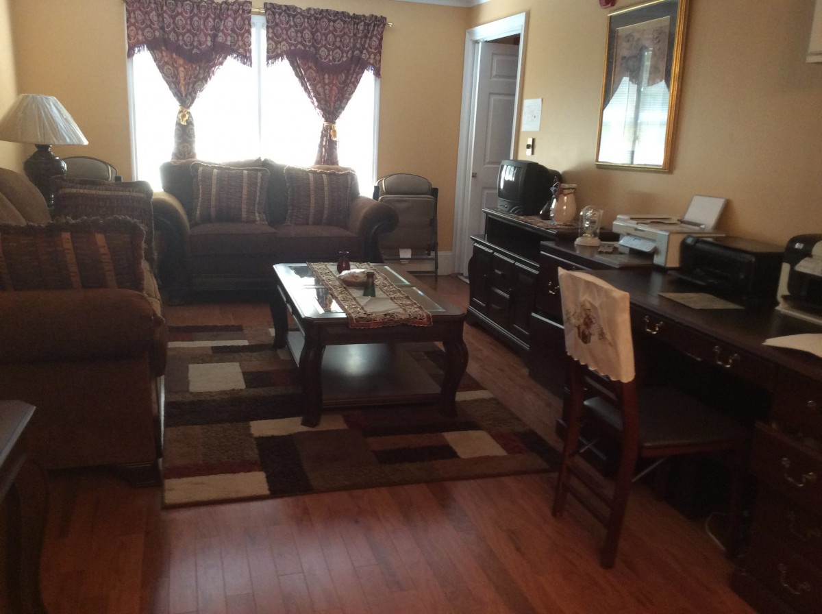 A cozy living room with a sofa, coffee table, and decorative elements.