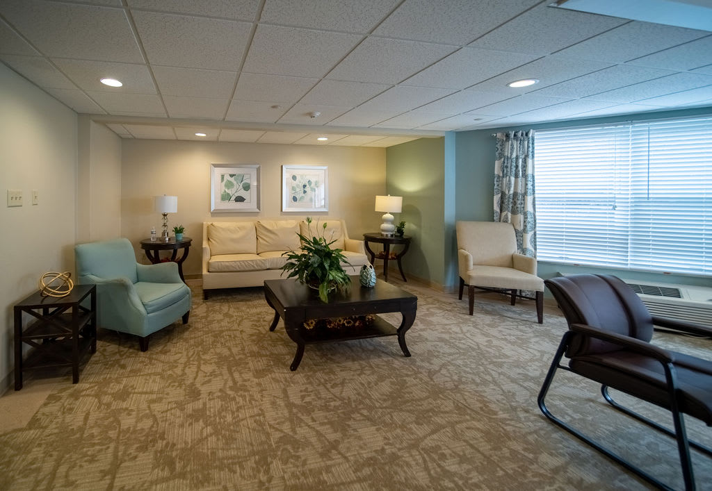 A cozy living room with comfortable seating and elegant decor.
