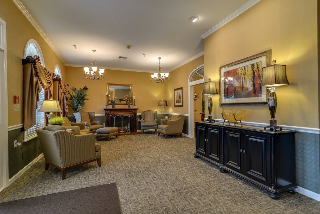 A cozy living room with elegant furniture and warm lighting.