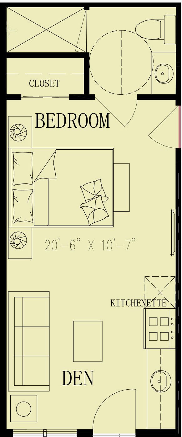 A detailed floor plan showing a room with dimensions and a kitchenette area.
