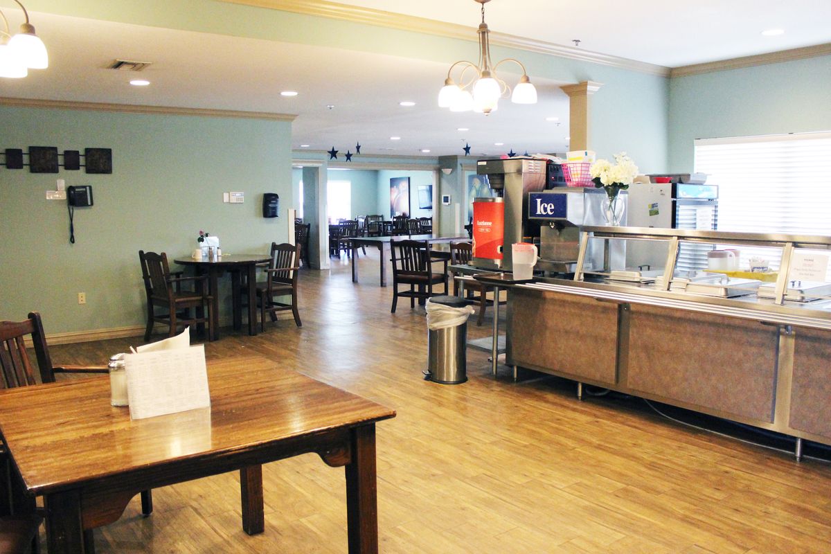 A spacious and casual dining area with a buffet setup.