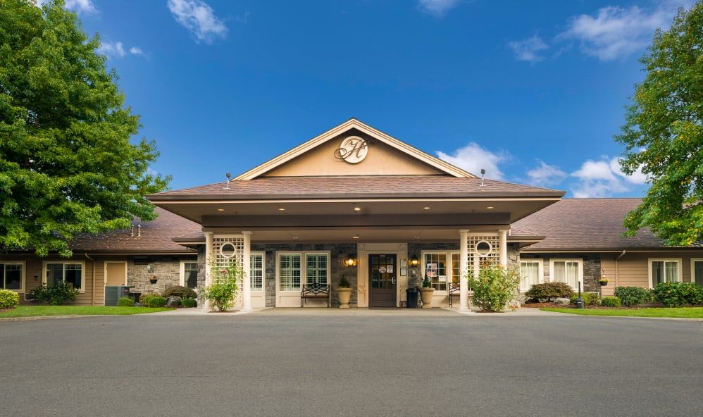 A welcoming building with a covered entrance and symmetrical design.