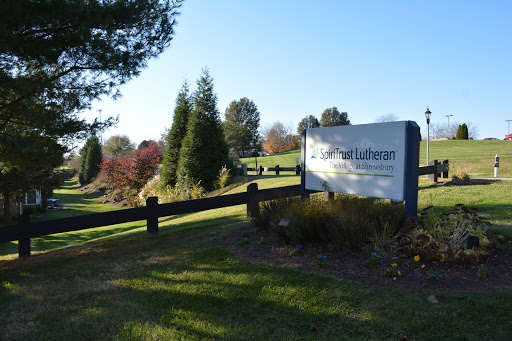 A welcoming entrance sign surrounded by well-maintained greenery.