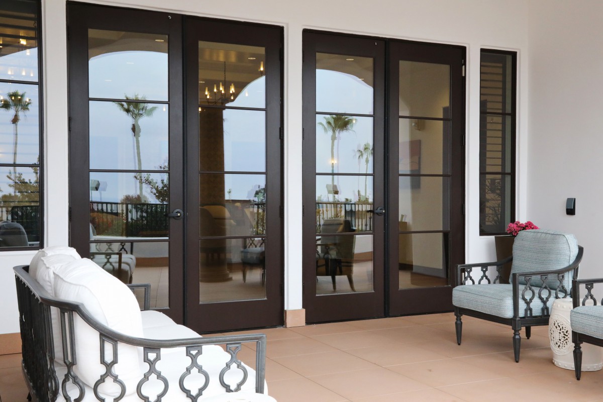 Elegant patio area with French doors and outdoor seating.