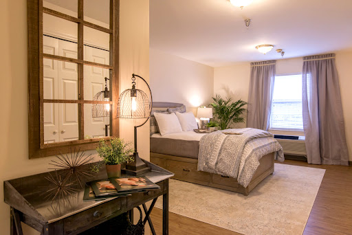 A beautifully designed modern bedroom featuring a comfortable bed, stylish furniture, and soft lighting.