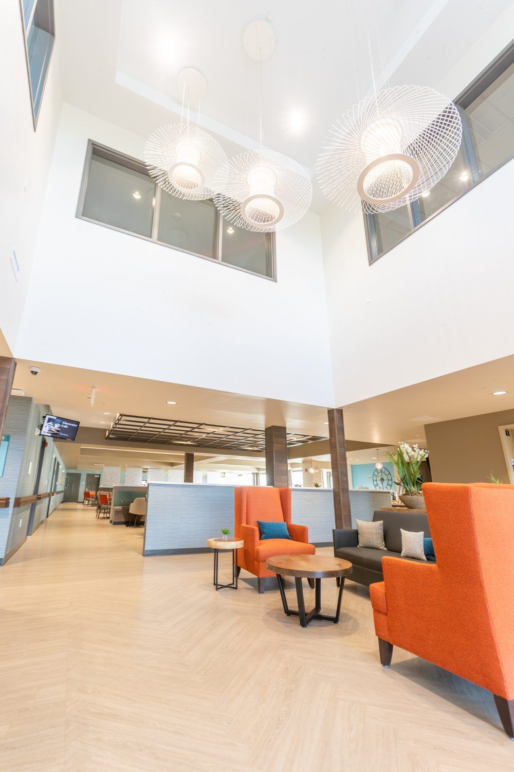 A modern office lobby with vibrant seating and ample natural light.