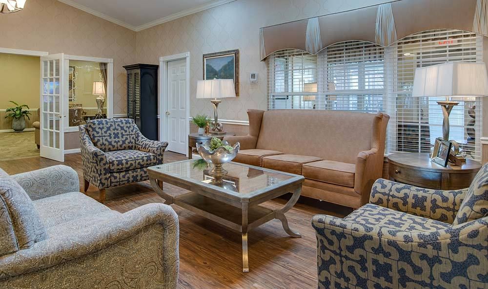 A cozy living room with elegant furnishings and tasteful decor.
