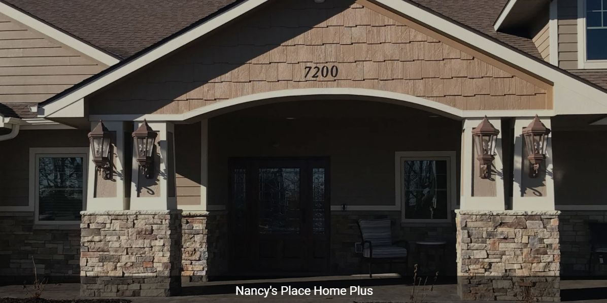 Entrance of a building with the address number '2700' displayed above the door.