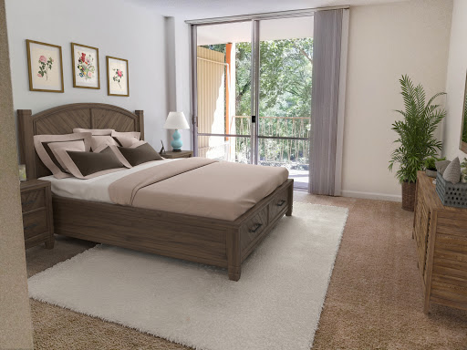 A serene modern bedroom featuring a comfortable bed and natural light streaming in from large windows.