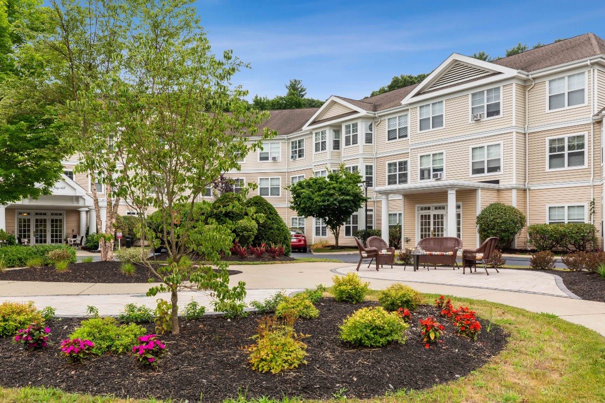 A landscaped garden in front of a residential building.