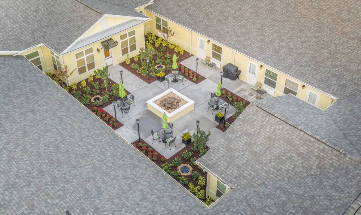 Aerial view of a landscaped courtyard with plants and seating areas.