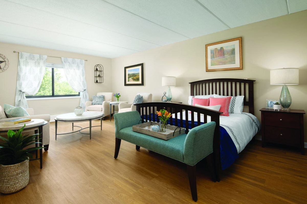 A modern and cozy bedroom with stylish furniture and decor.