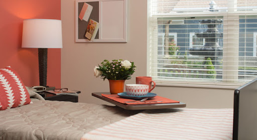 A cozy breakfast setup featuring a floral centerpiece and colorful tableware.