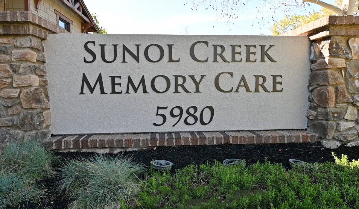 Sign for Sunol Creek Memory Care facility with address number 5980.