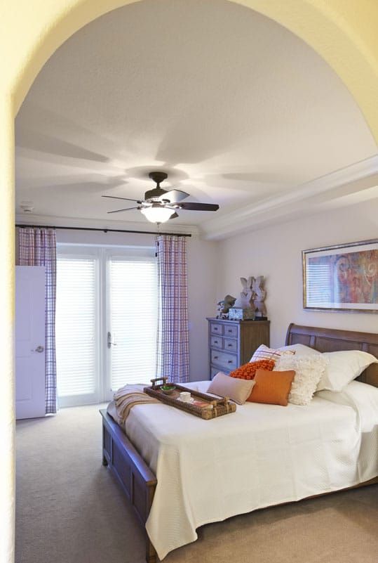 A modern bedroom with elegant decor and a cozy atmosphere.