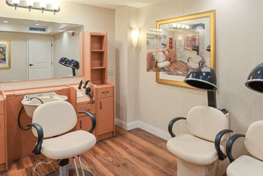 A neatly arranged hair salon with styling chairs and mirrors.