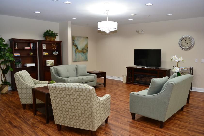 A cozy living room with comfortable seating and a television.