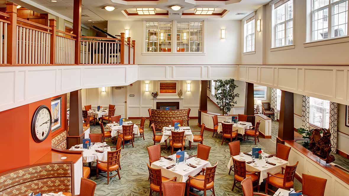 Elegant restaurant dining area with neatly arranged tables and chairs.