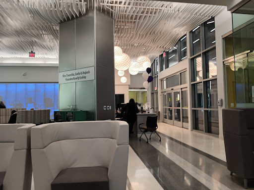 A modern lobby featuring sleek furniture and creative lighting designs.