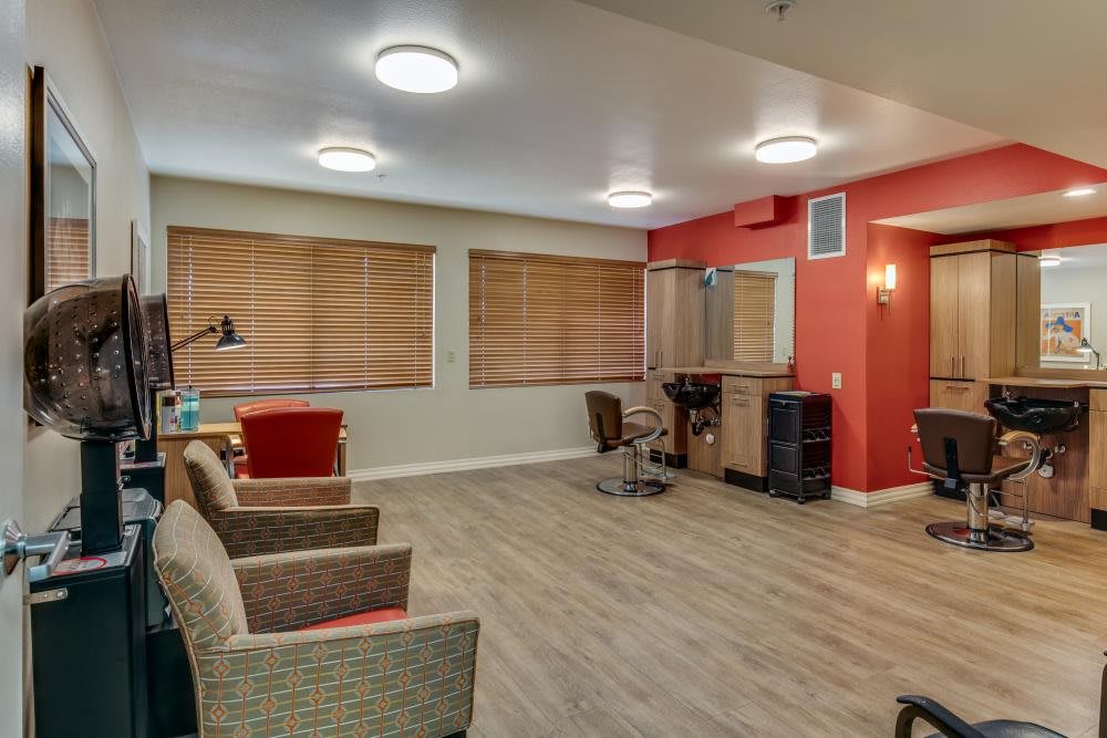 A modern living room with wooden flooring and comfortable seating.
