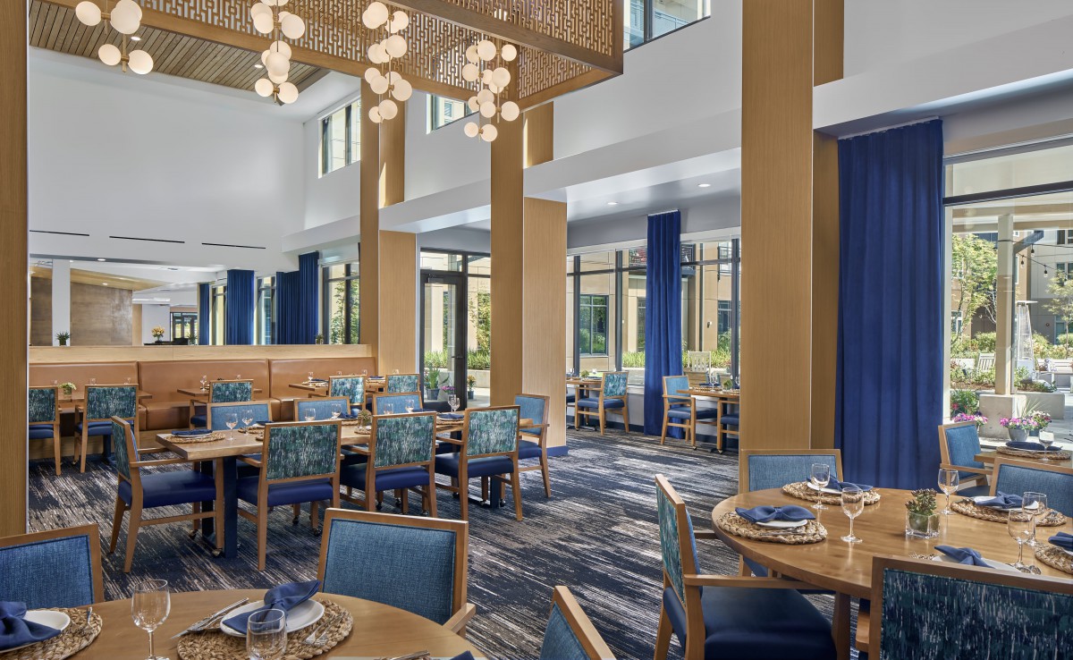 A modern restaurant dining area with elegant decor and lighting.