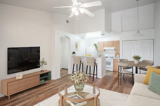 A stylish open-concept living area featuring a modern kitchen and cozy seating arrangement.