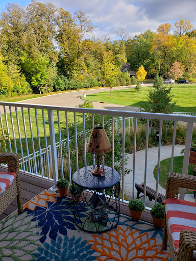 A cozy balcony view overlooking a lush landscape, perfect for relaxation.