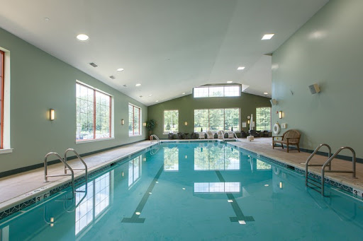 A spacious indoor swimming pool area, perfect for relaxation and fitness activities.