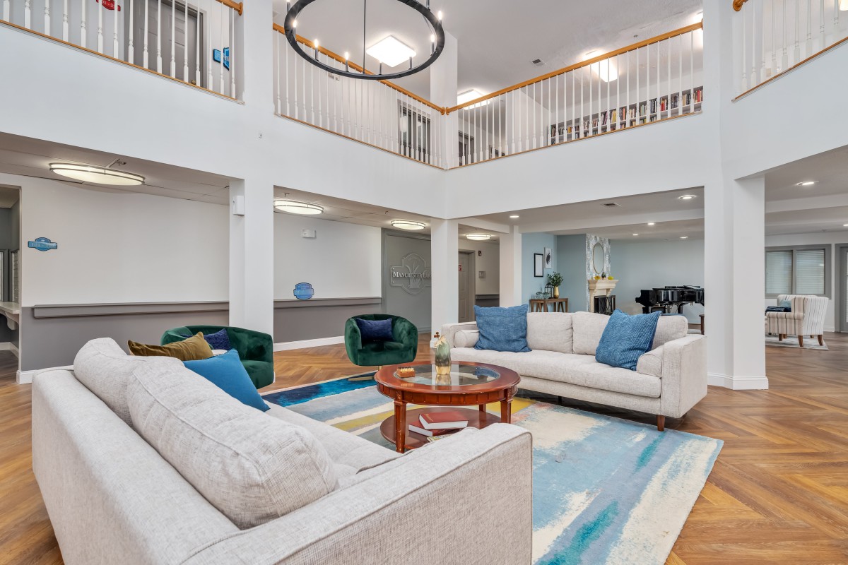 A spacious, modern living room featuring comfortable sofas and a stylish coffee table.