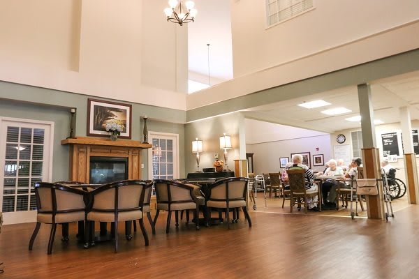 Spacious dining area with elegant furnishings and warm lighting.