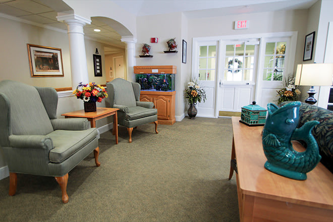A well-decorated waiting room with comfortable seating and elegant decor.