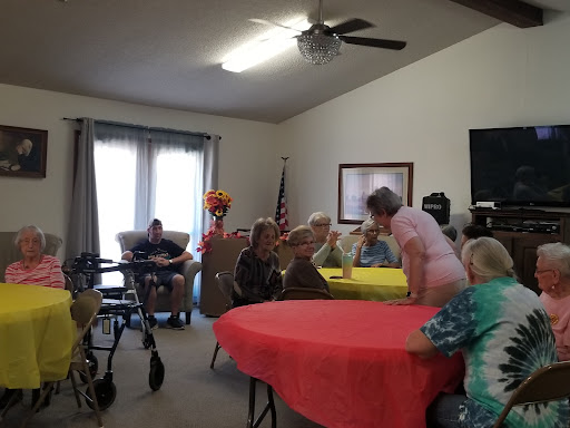 A lively gathering of senior citizens enjoying a social event in a community space.