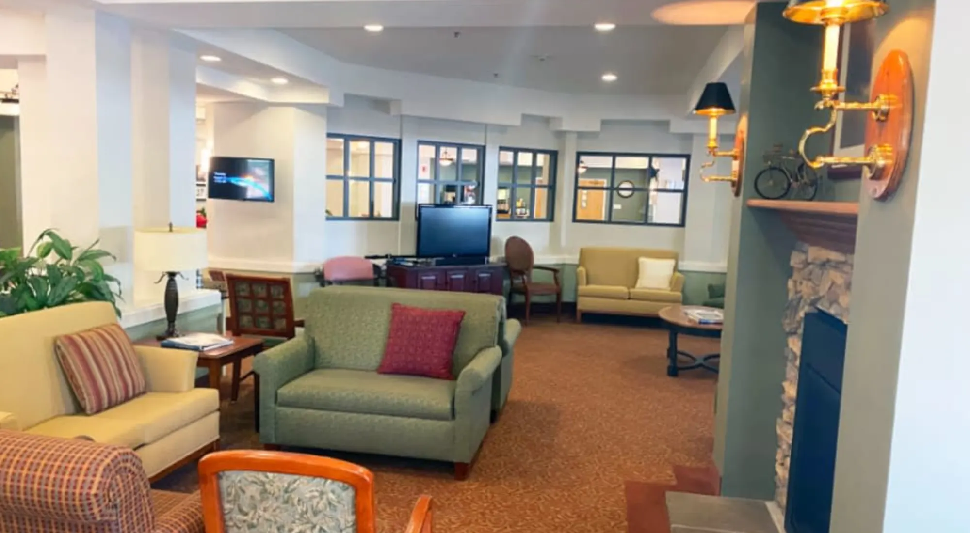A cozy living room with comfortable seating and a television.